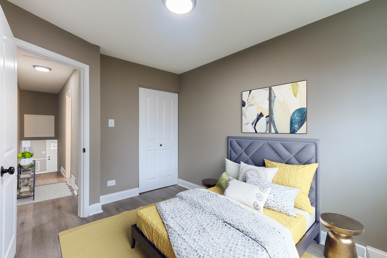 10002 South Normal Avenue Chicago, IL 60628 - Photo 5 of 29 a bedroom with a bed and painting on the wall