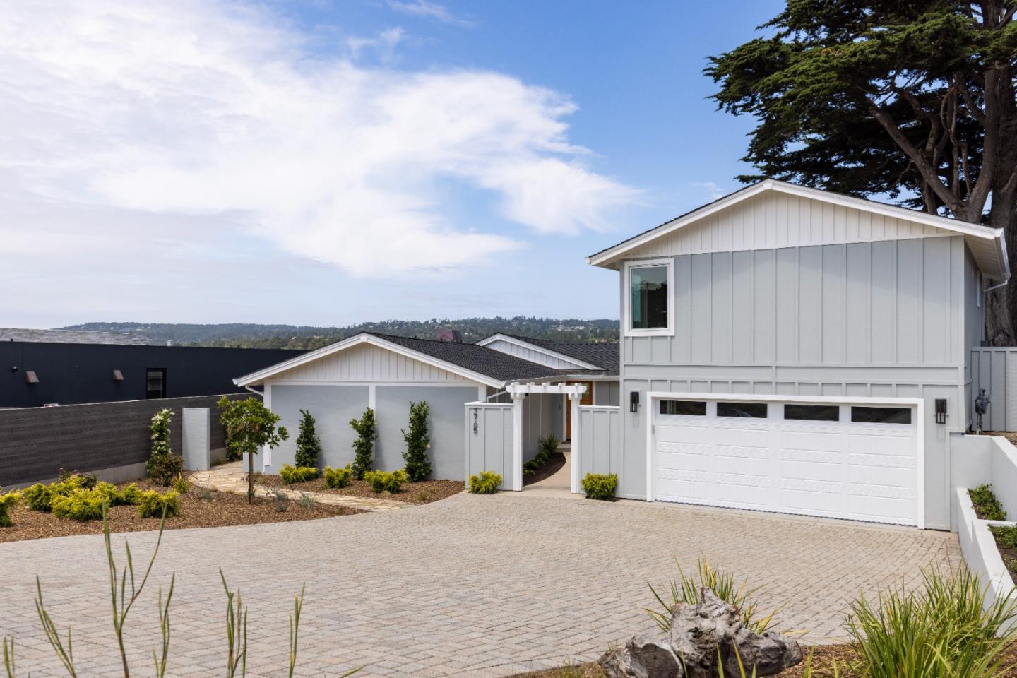 2765 Ribera Road Carmel, CA 93923 - Photo 1 of 37 a front view of a house with a yard and garage