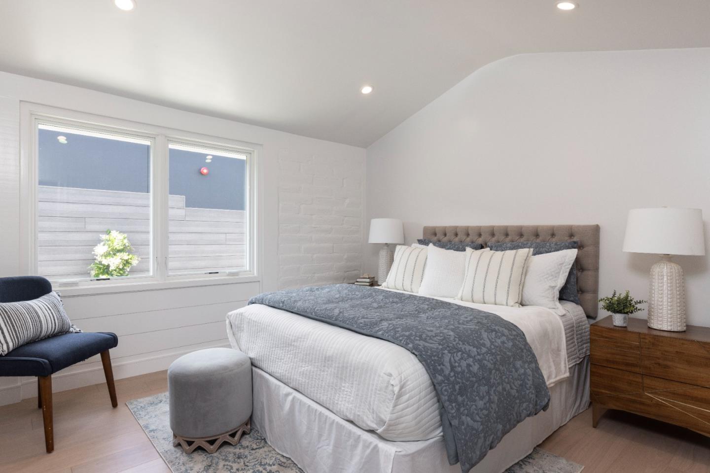 2765 Ribera Road Carmel, CA 93923 - Photo 12 of 37 a bedroom with a bed and a couch
