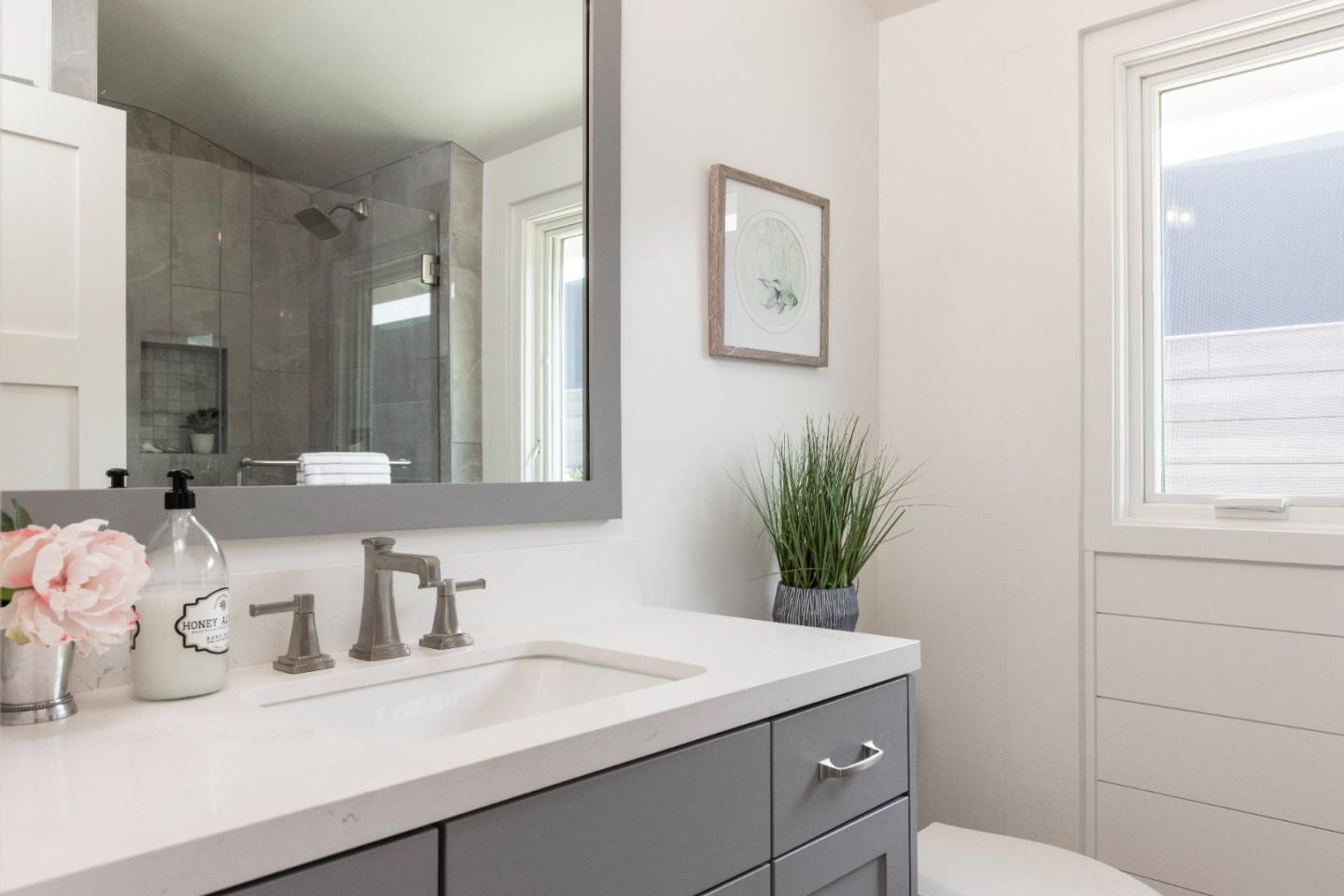 2765 Ribera Road Carmel, CA 93923 - Photo 13 of 37 a bathroom with a sink and a mirror
