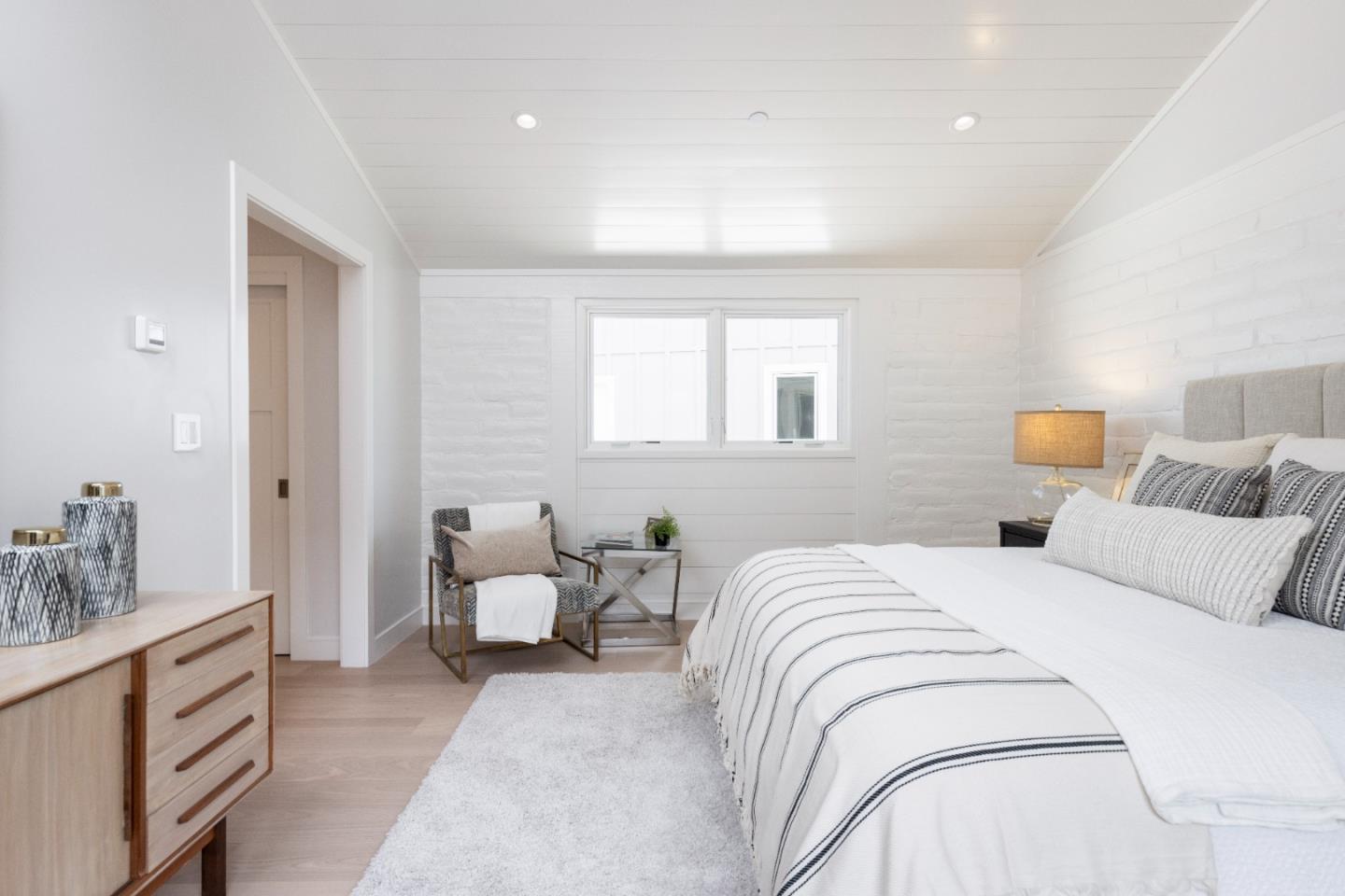 2765 Ribera Road Carmel, CA 93923 - Photo 15 of 37 a bedroom with a bed and ceiling fan