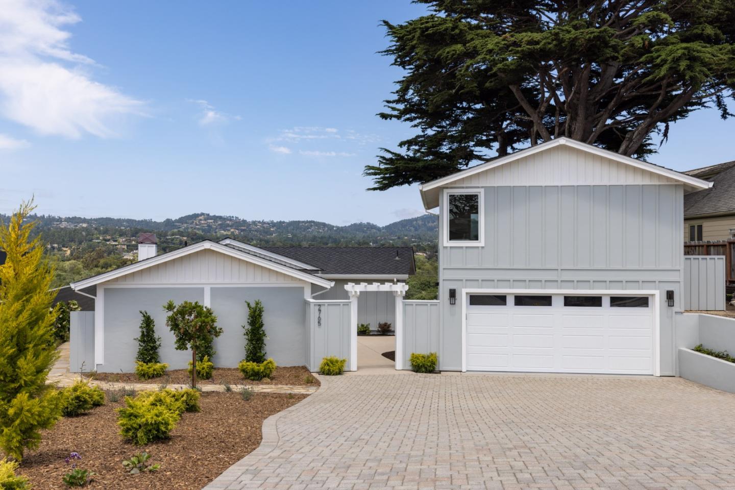 2765 Ribera Road Carmel, CA 93923 - Photo 2 of 37 a front view of a house with a yard and garage