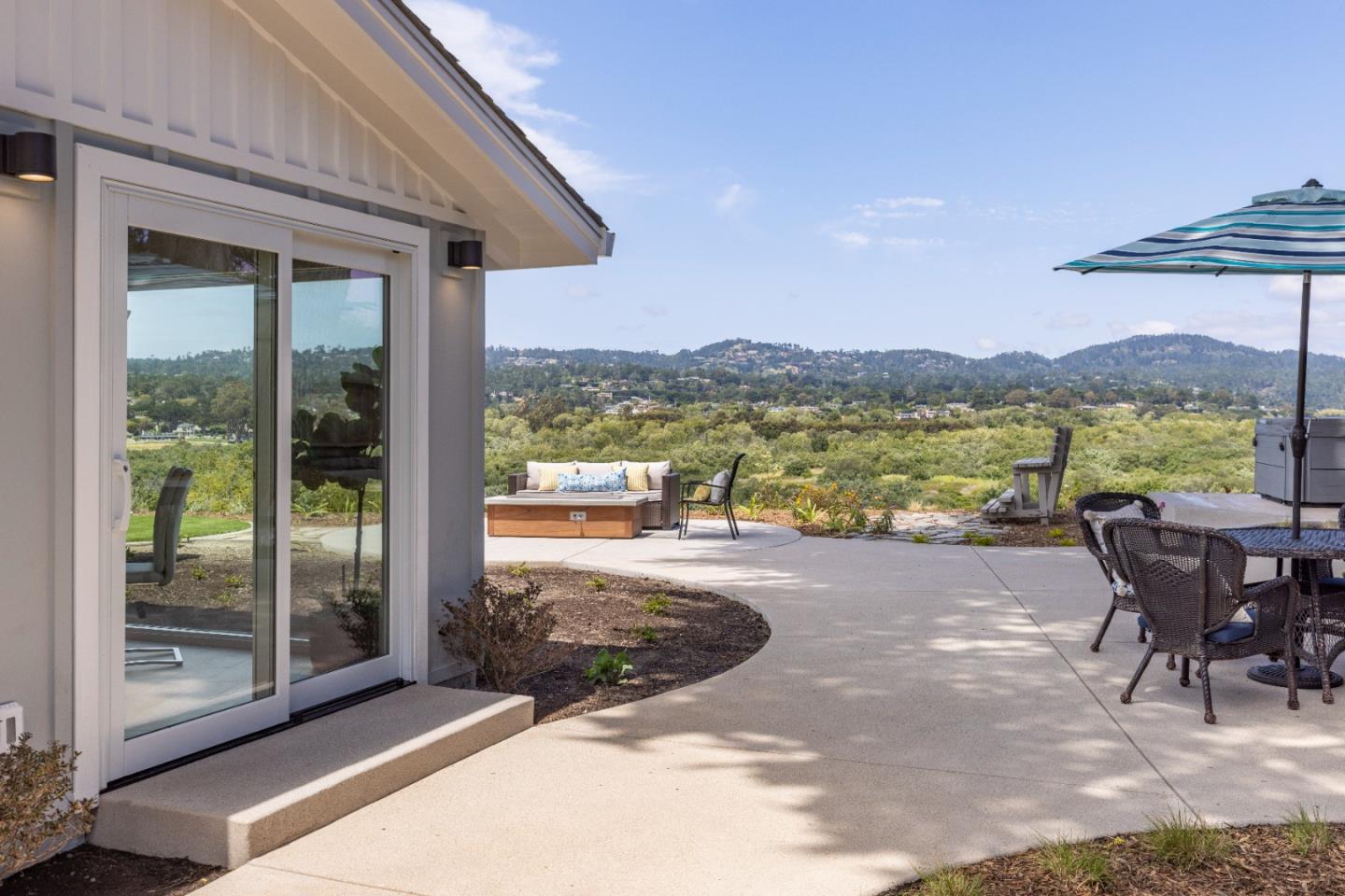 2765 Ribera Road Carmel, CA 93923 - Photo 26 of 37 a view of a terrace with a table and chairs
