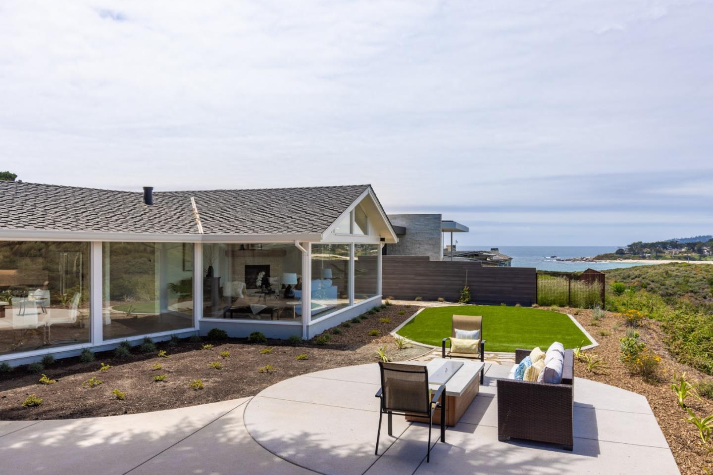 2765 Ribera Road Carmel, CA 93923 - Photo 4 of 37 an outdoor space with lounge chair and glass door