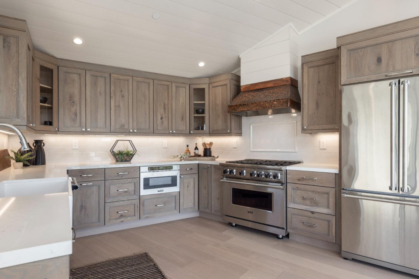 2765 Ribera Road Carmel, CA 93923 - Photo 10 of 37 a kitchen with cabinets and stainless steel appliances