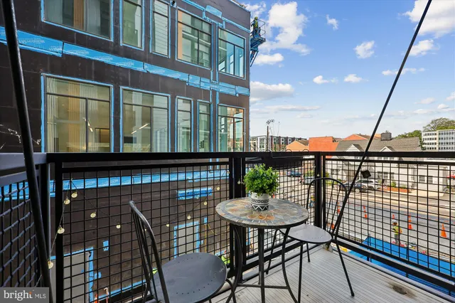 a view of a balcony with chairs