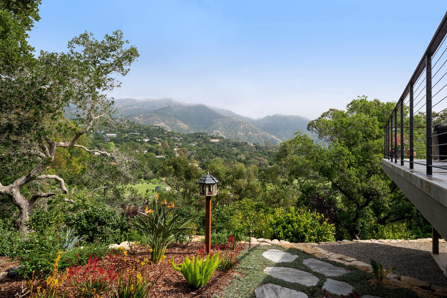 1702 Hillcrest Road Santa Barbara, CA 93103 - Photo 1 of 27 a view of a city with lush green forest