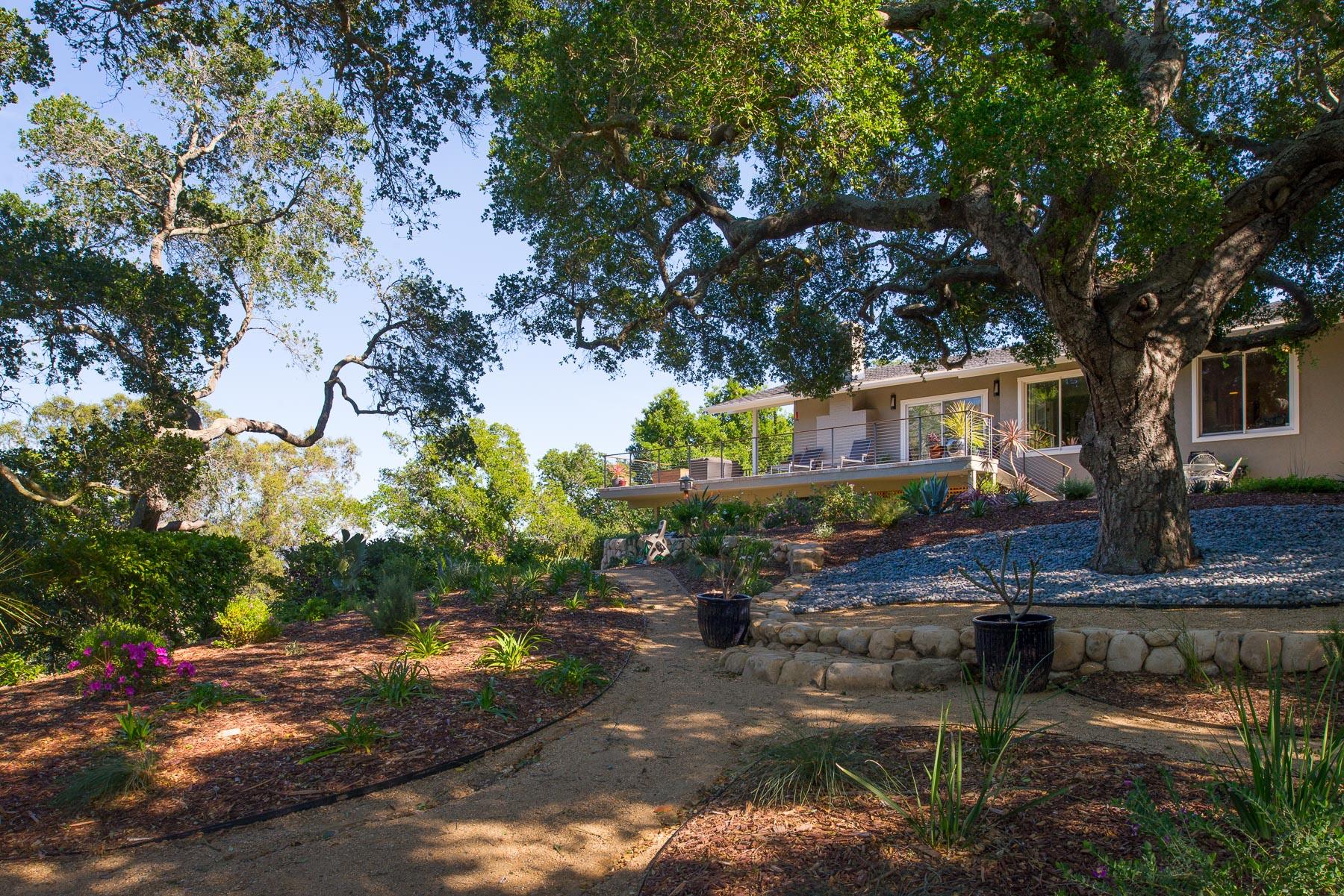 1702 Hillcrest Road Santa Barbara, CA 93103 - Photo 16 of 27 a house with trees in the background