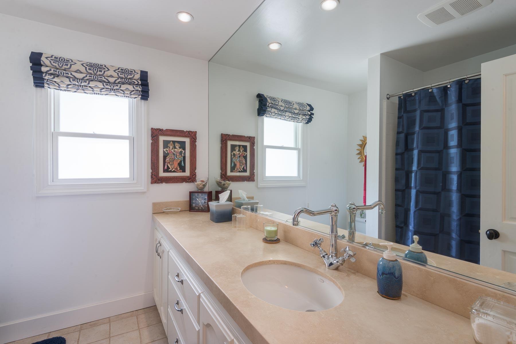 1702 Hillcrest Road Santa Barbara, CA 93103 - Photo 22 of 27 a bathroom with a sink double vanity and a window