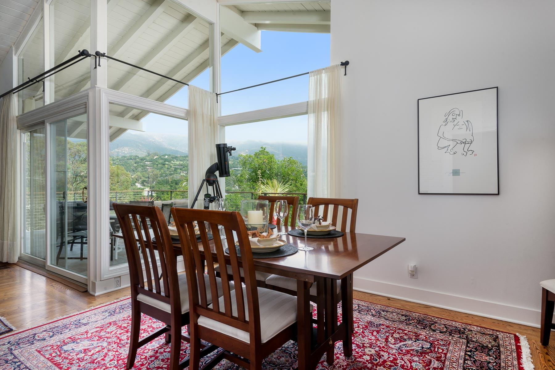 1702 Hillcrest Road Santa Barbara, CA 93103 - Photo 25 of 27 a view of a dining room with furniture window and wooden floor