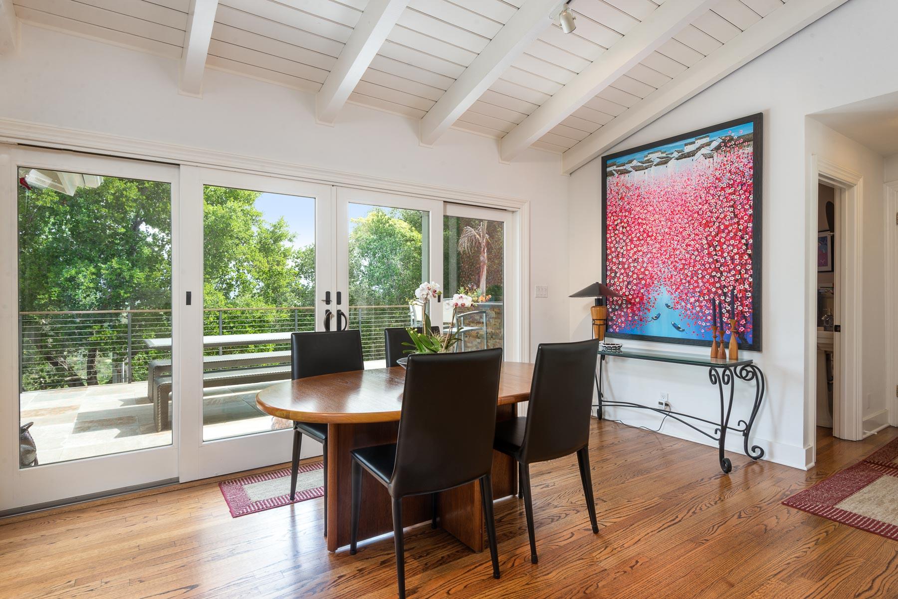 1702 Hillcrest Road Santa Barbara, CA 93103 - Photo 7 of 27 a view of a dining room with furniture window and wooden floor