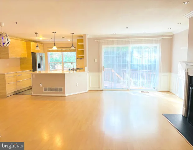 a view of an empty room with a fireplace