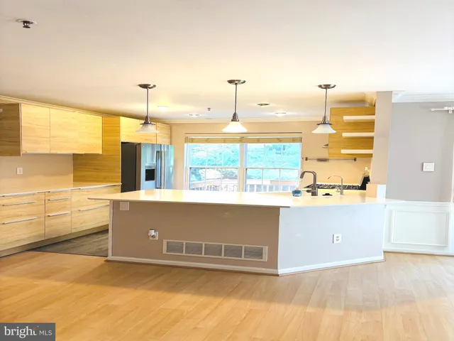 a view of kitchen and kitchen with sink
