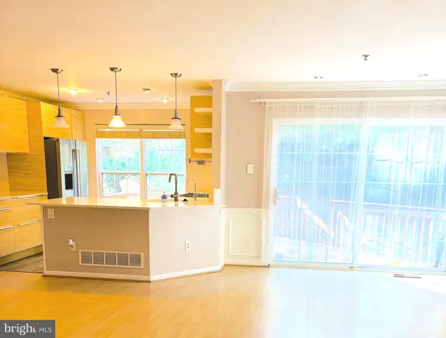 a view of a kitchen with a window