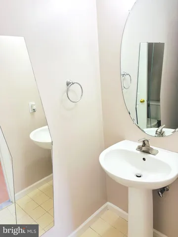 a bathroom with a sink and mirror