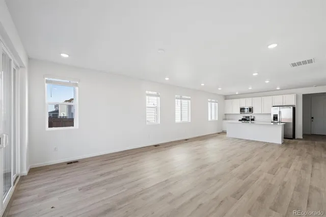 a view of a livingroom with wooden floor