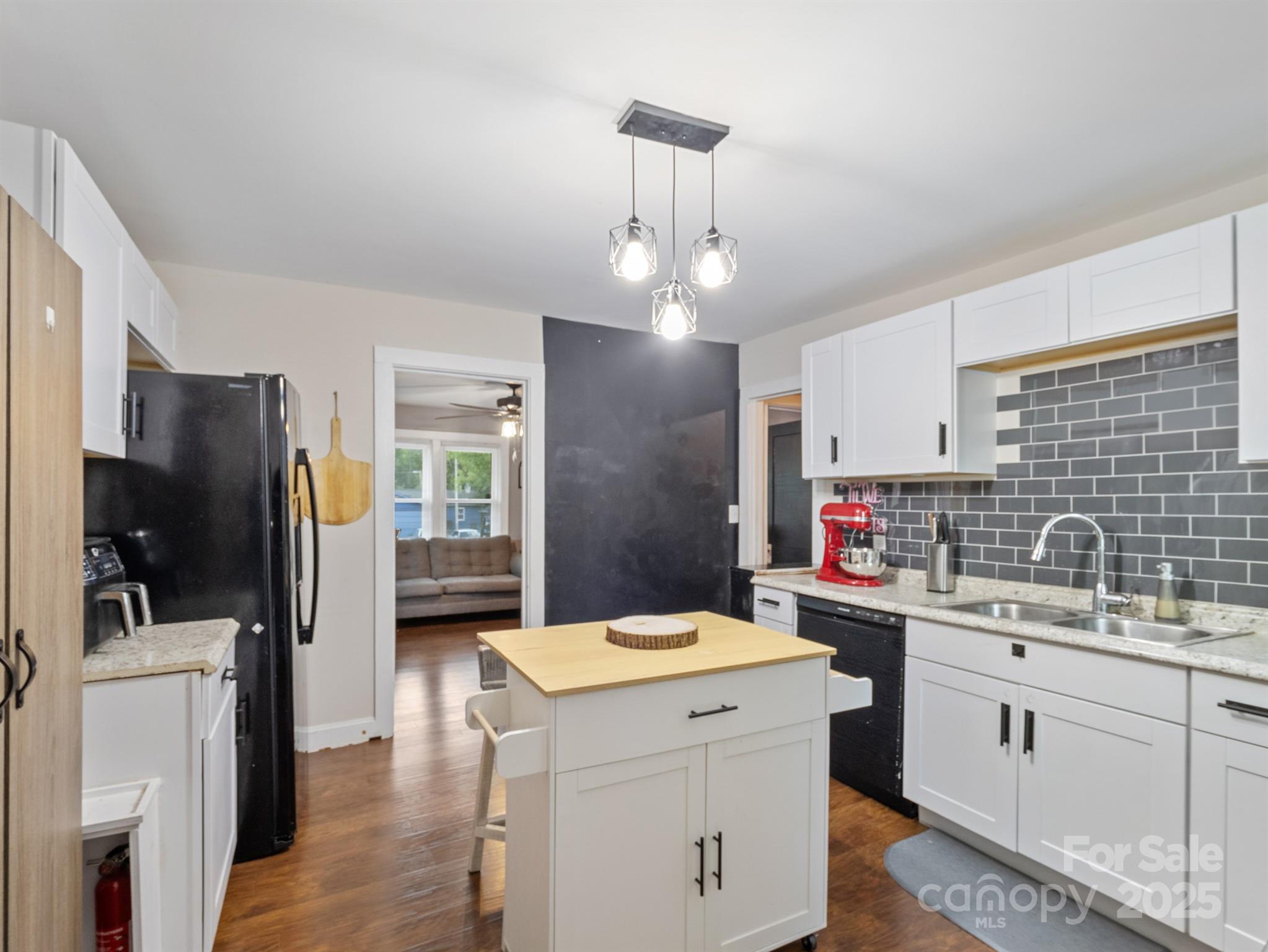 206 Friedheim Road Rock Hill, SC 29730 - Photo 11 of 25 a kitchen that has a lot of cabinets stainless steel appliances and wooden floor