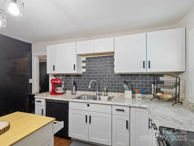 a kitchen with sink cabinets and stove