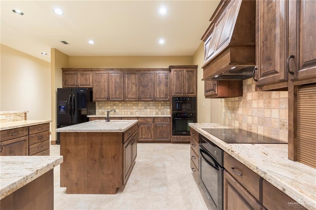 3007 Bryan Road Mission, TX 78574 - Photo 13 of 43 Lots of storage and solid cabinets throughout the large kitchen.