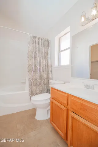 a bathroom with a toilet a sink and bathtub