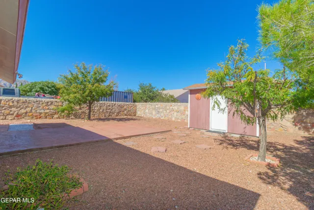 a view of a yard in front of a house