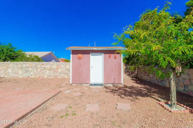 a view of backyard with large trees