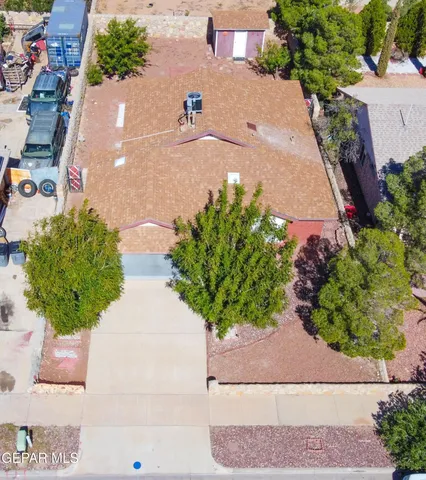 an aerial view of residential houses with outdoor space and street view