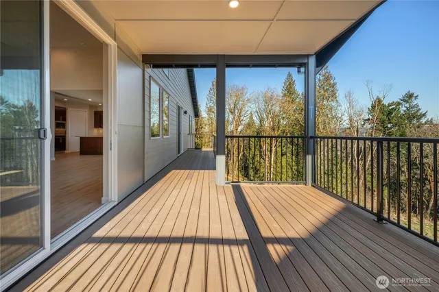 a view of balcony with wooden floor