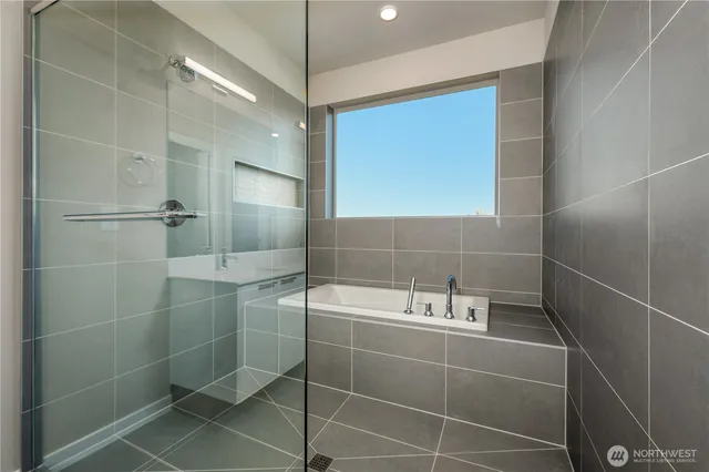 a bathroom with a shower and a sink