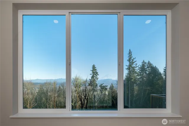 a view of a room that has a large window