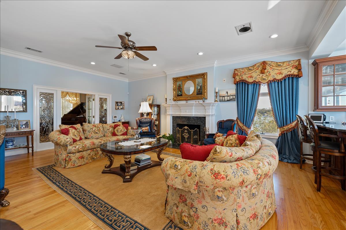 83 Poquito Road Shalimar, FL 32579 - Photo 15 of 83 a living room with furniture a fireplace and a flat screen tv