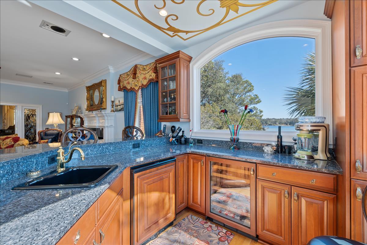 83 Poquito Road Shalimar, FL 32579 - Photo 20 of 83 a kitchen with stainless steel appliances granite countertop sink stove and cabinets