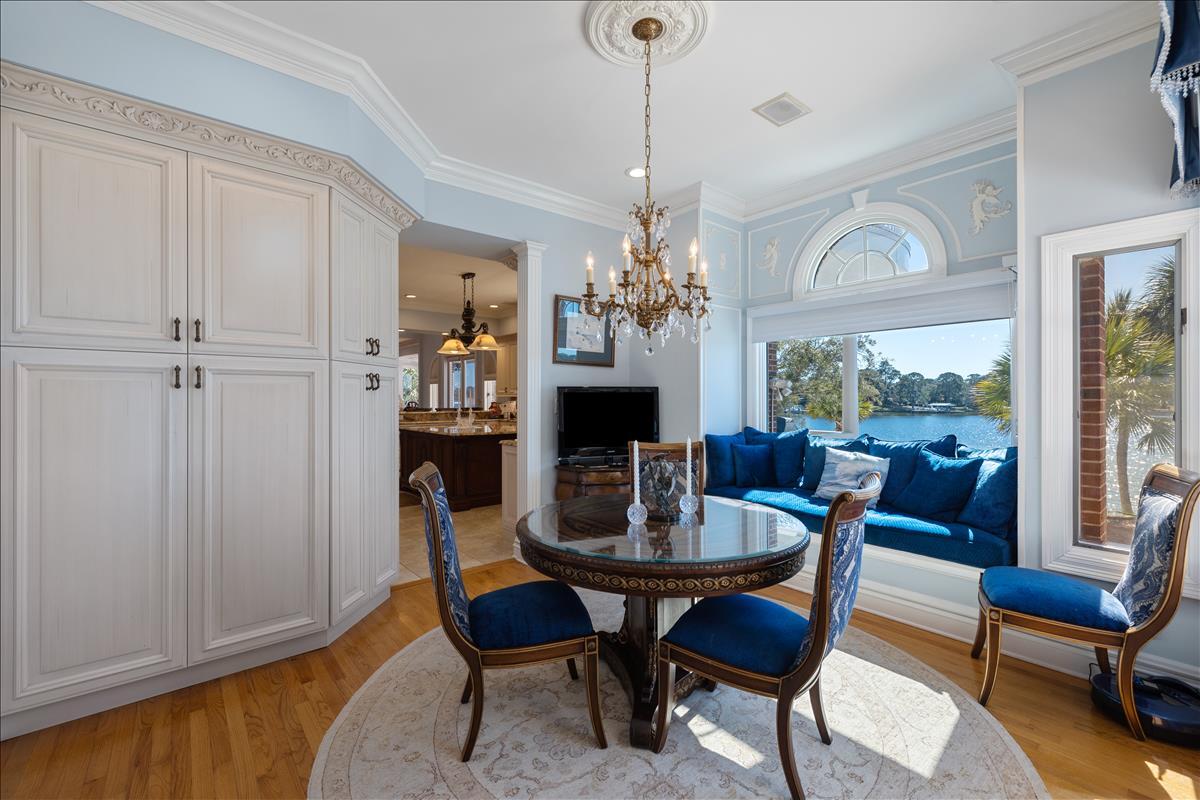 83 Poquito Road Shalimar, FL 32579 - Photo 26 of 83 a view of a dining room with furniture window and wooden floor