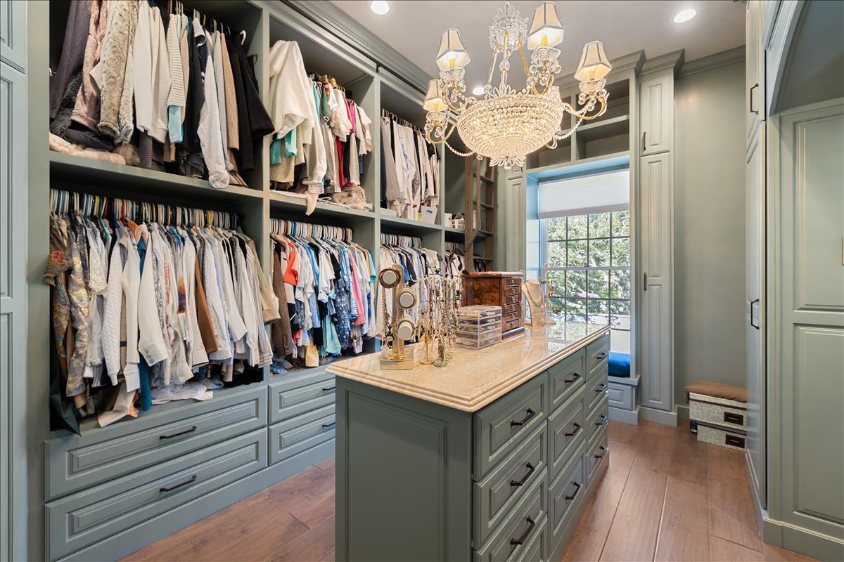 83 Poquito Road Shalimar, FL 32579 - Photo 49 of 83 a view of walk in closet with clothes and shoes