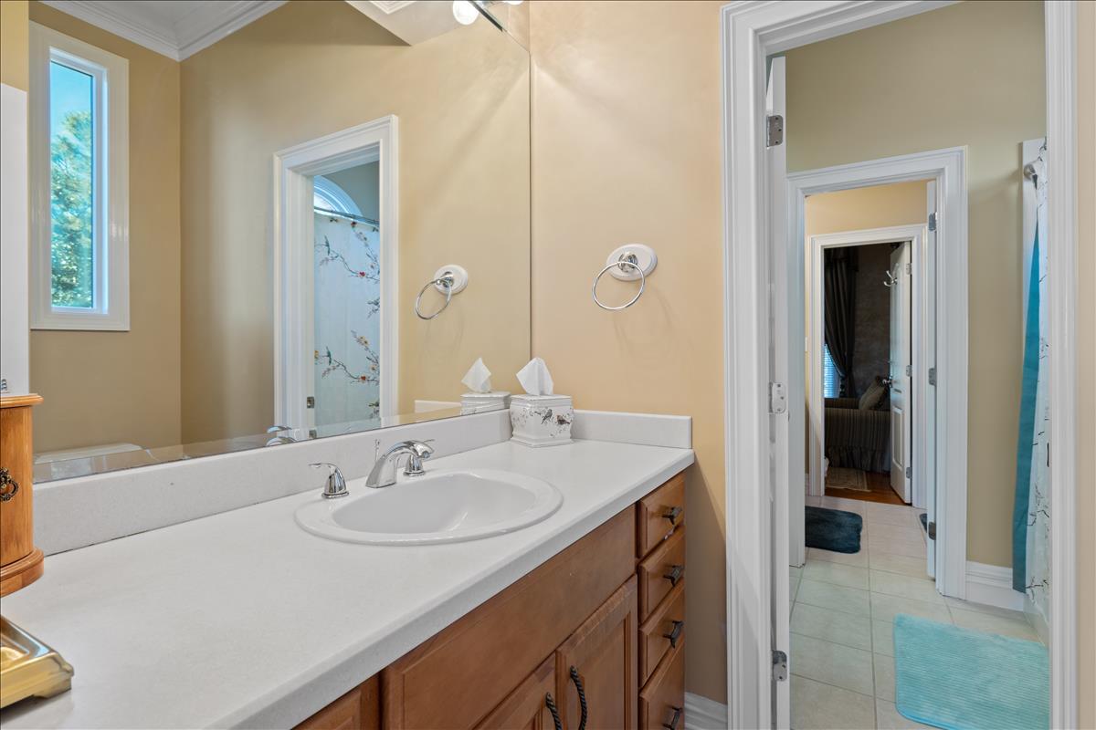83 Poquito Road Shalimar, FL 32579 - Photo 52 of 83 a bathroom with a sink and a mirror