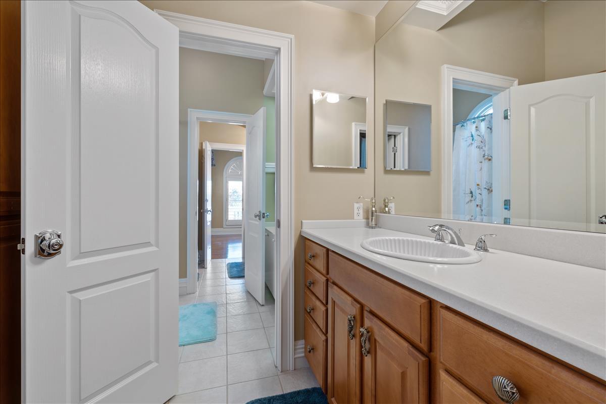 83 Poquito Road Shalimar, FL 32579 - Photo 53 of 83 a bathroom with a sink and a mirror
