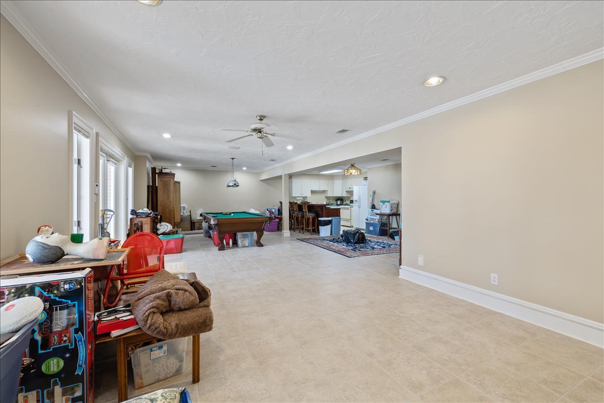 83 Poquito Road Shalimar, FL 32579 - Photo 56 of 83 a living room with lots of furniture and a chandelier