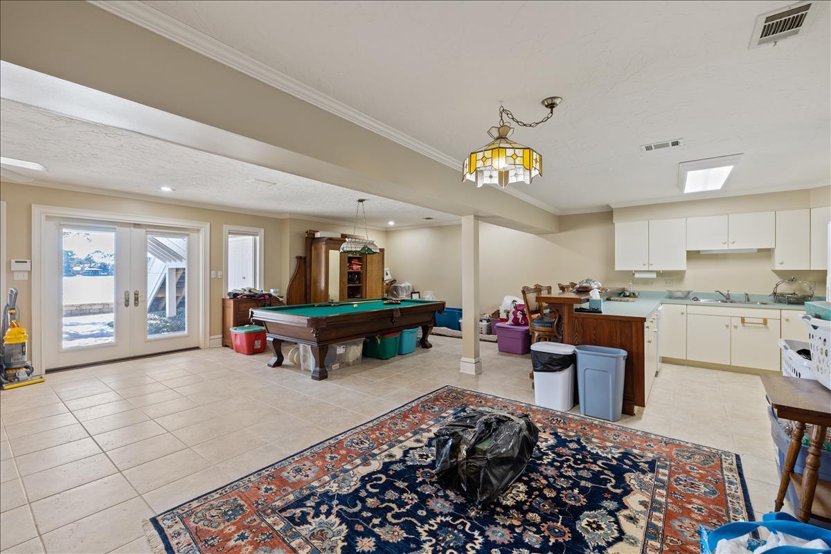 83 Poquito Road Shalimar, FL 32579 - Photo 58 of 83 a living room with furniture and a open kitchen view