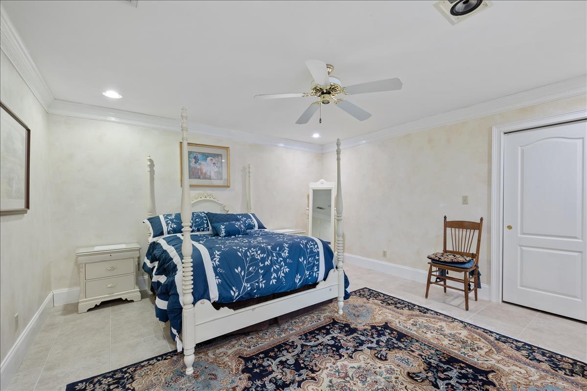 83 Poquito Road Shalimar, FL 32579 - Photo 60 of 83 a bedroom with a bed and a table in it