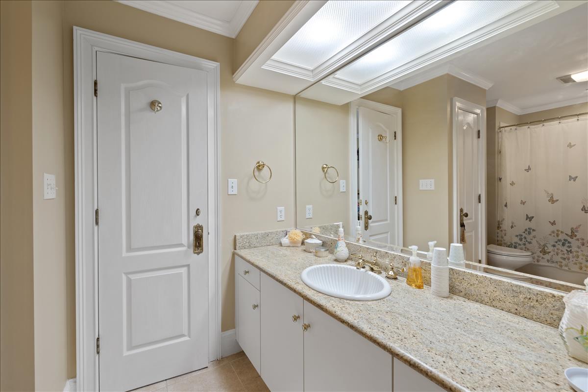 83 Poquito Road Shalimar, FL 32579 - Photo 61 of 83 a bathroom with a granite countertop sink and a mirror