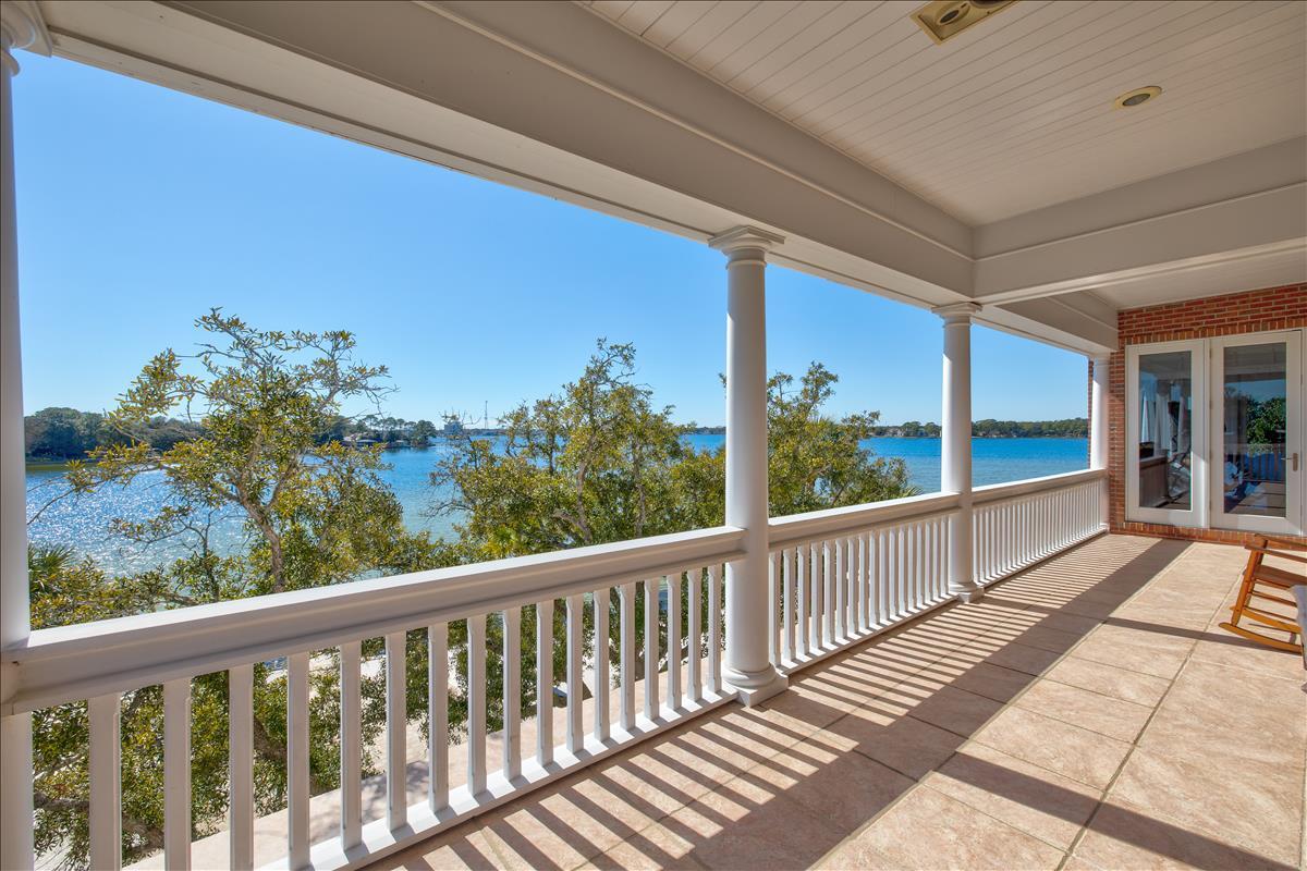 83 Poquito Road Shalimar, FL 32579 - Photo 63 of 83 a view of a balcony with wooden floor