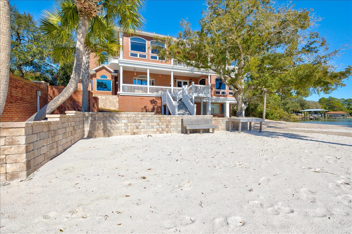 83 Poquito Road Shalimar, FL 32579 - Photo 69 of 83 a view of a house with a patio