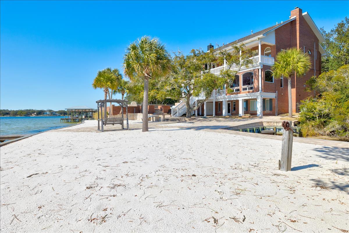 83 Poquito Road Shalimar, FL 32579 - Photo 70 of 83 a view of a building with a yard