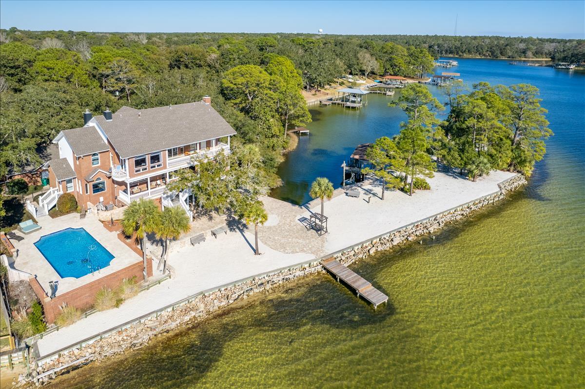 83 Poquito Road Shalimar, FL 32579 - Photo 77 of 83 a view of a lake with a mountain in the background