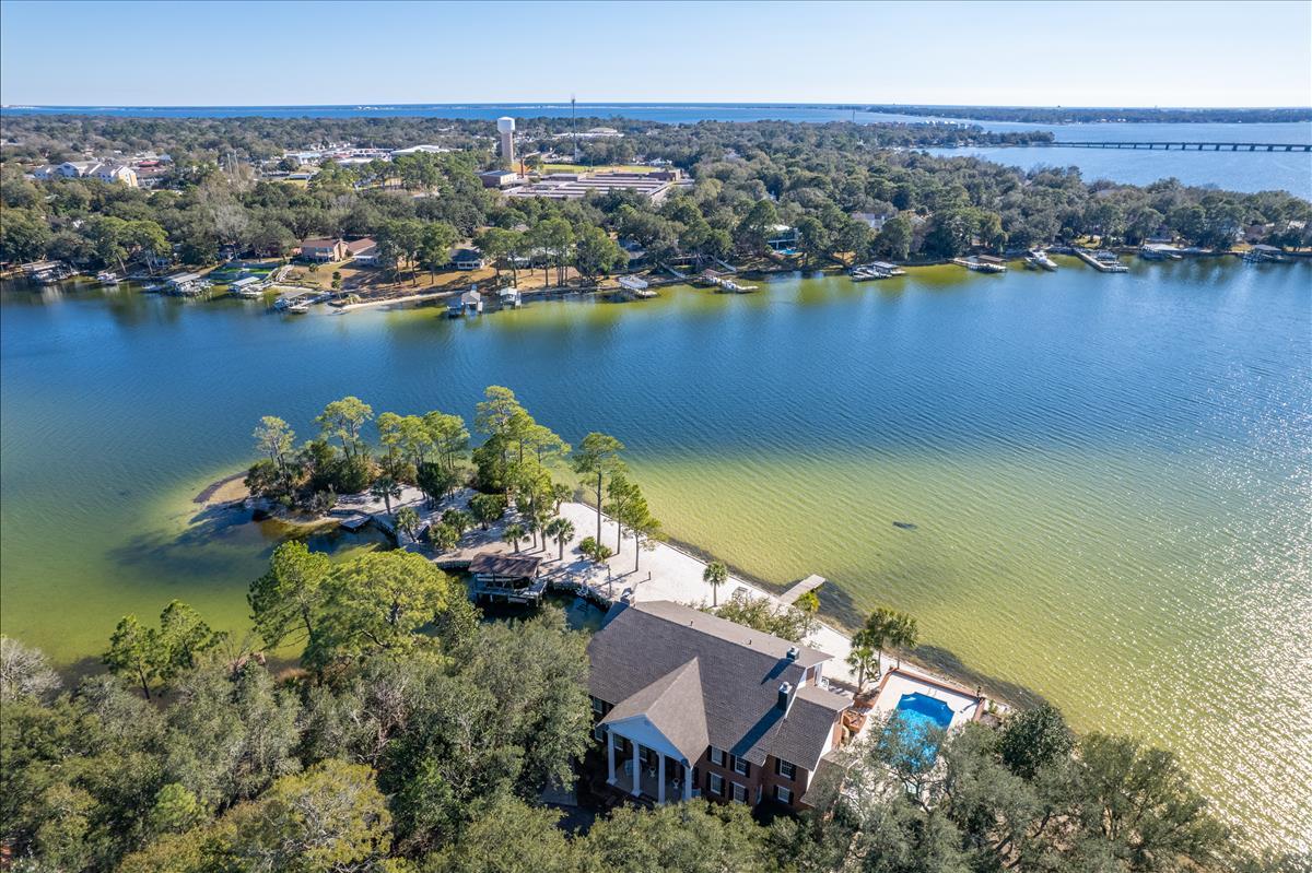 83 Poquito Road Shalimar, FL 32579 - Photo 82 of 83 an aerial view of a house with a lake view