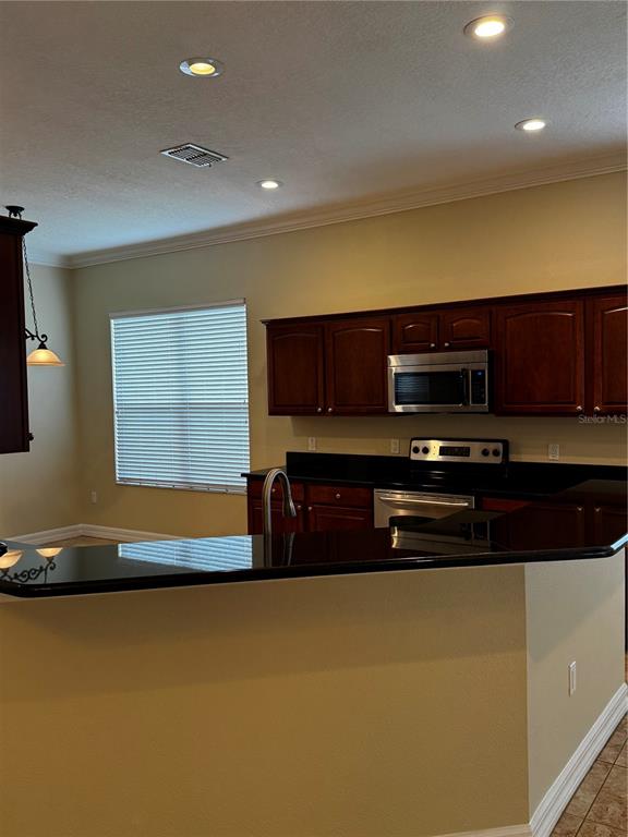 6871 Eagle Ridge Loop Lakeland, FL 33813 - Photo 10 of 42 a view of room with microwave and door