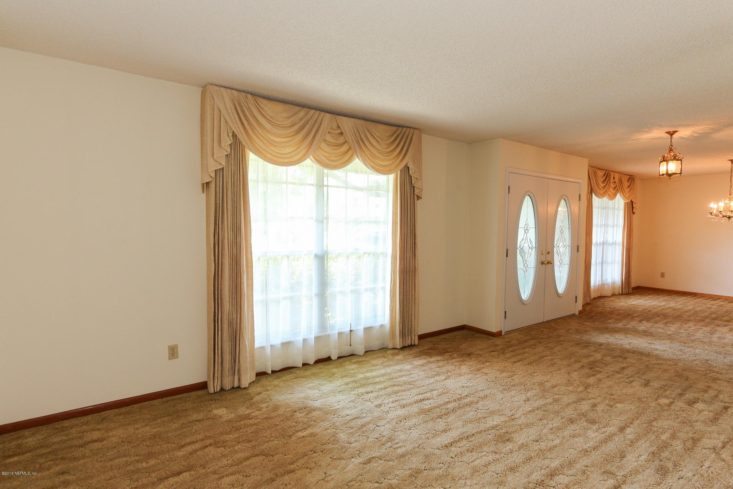 5660 Swamp Fox Road Jacksonville, FL 32210 - Photo 12 of 79 Living Room View 3