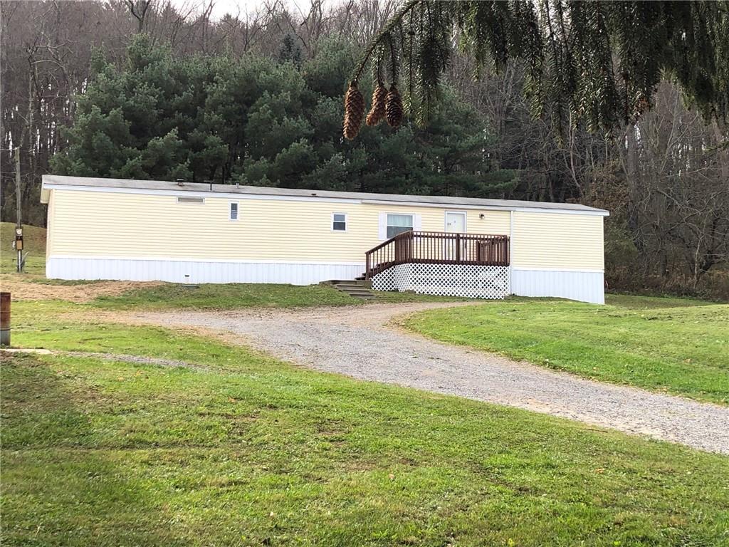 106 Bish Road Butler, PA 16002 - Photo 2 of 9 a view of a field with trees in the background