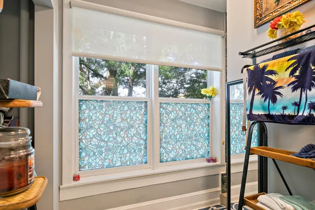 a bathroom with a tub that has a glass door shower