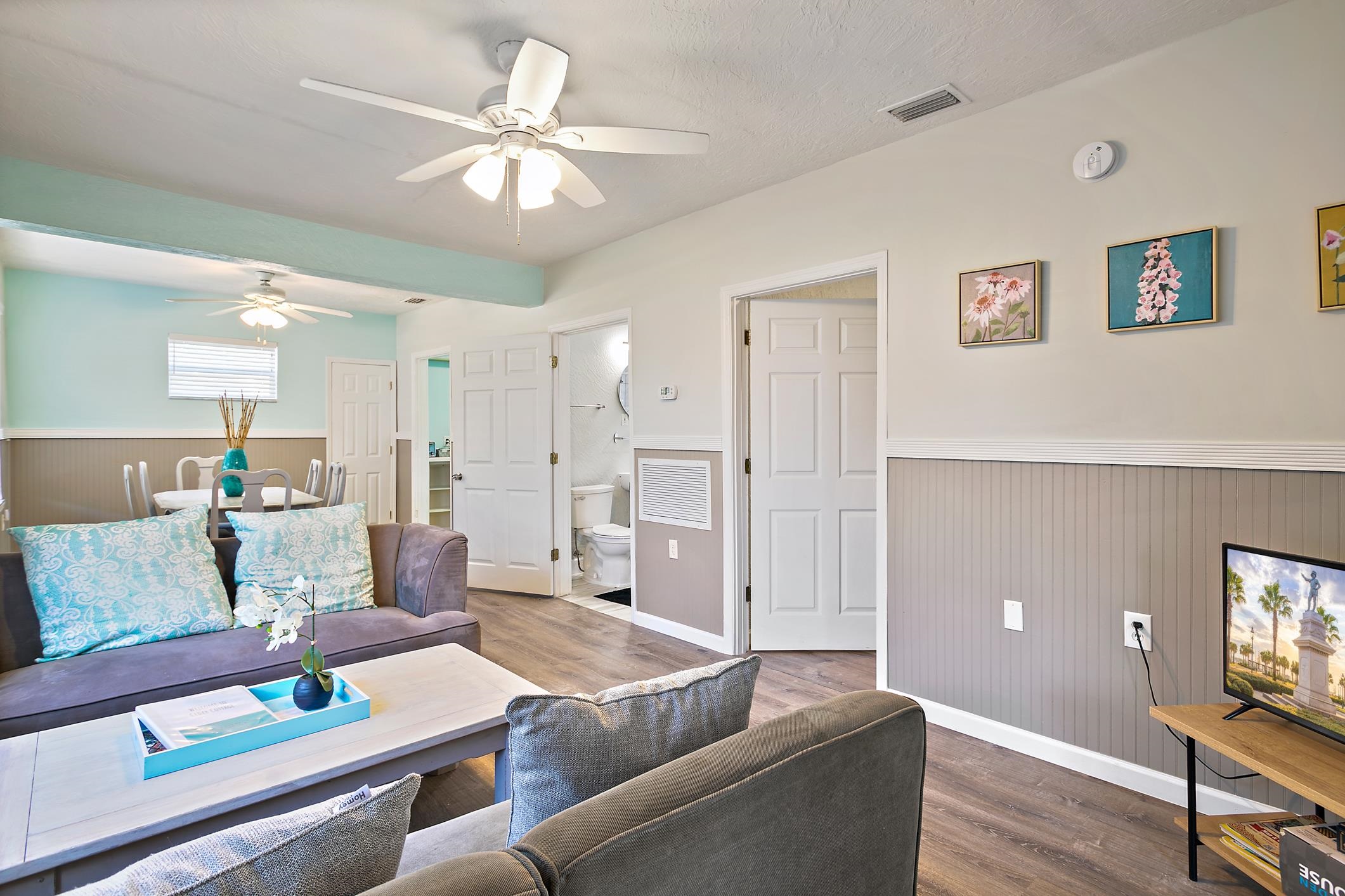 56 Grove Avenue St. Augustine, FL 32084 - Photo 19 of 48 a living room with furniture and a chandelier